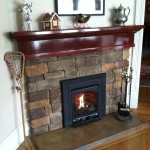 Custom gas fireplace with handcrafted mantle