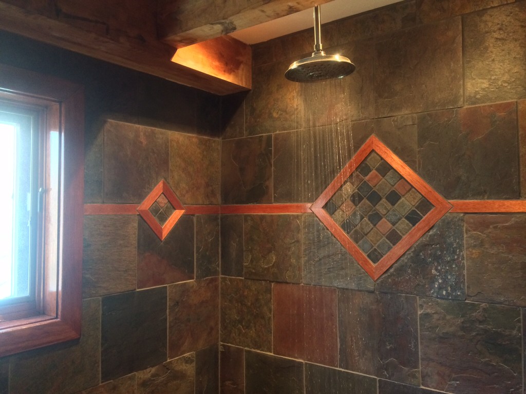 Inlayed wood in slate shower